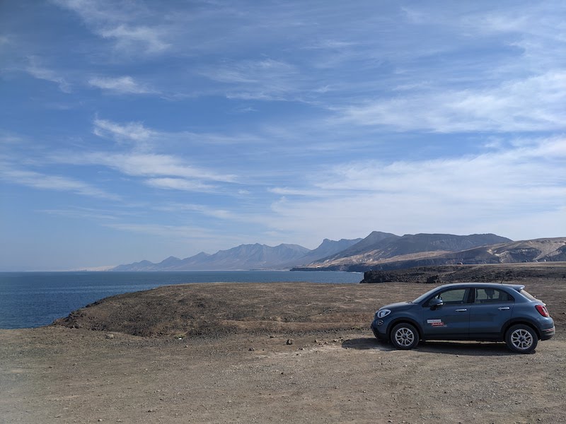 Hire car with Cofete beach and Pico La Zarza in the distance