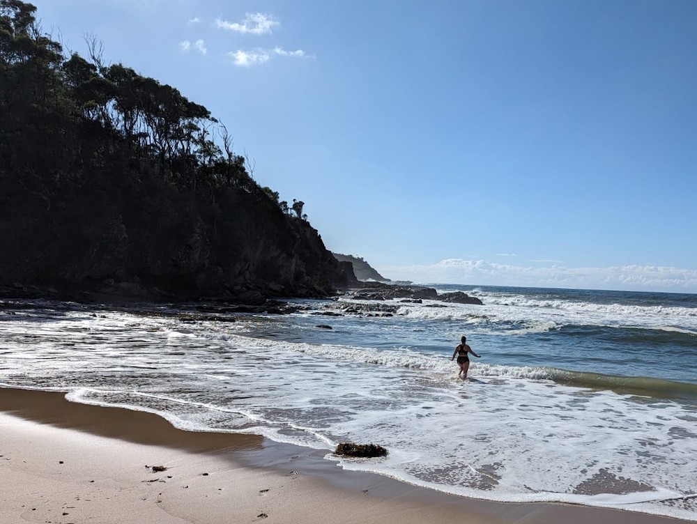 Taking a dip on a wild beach